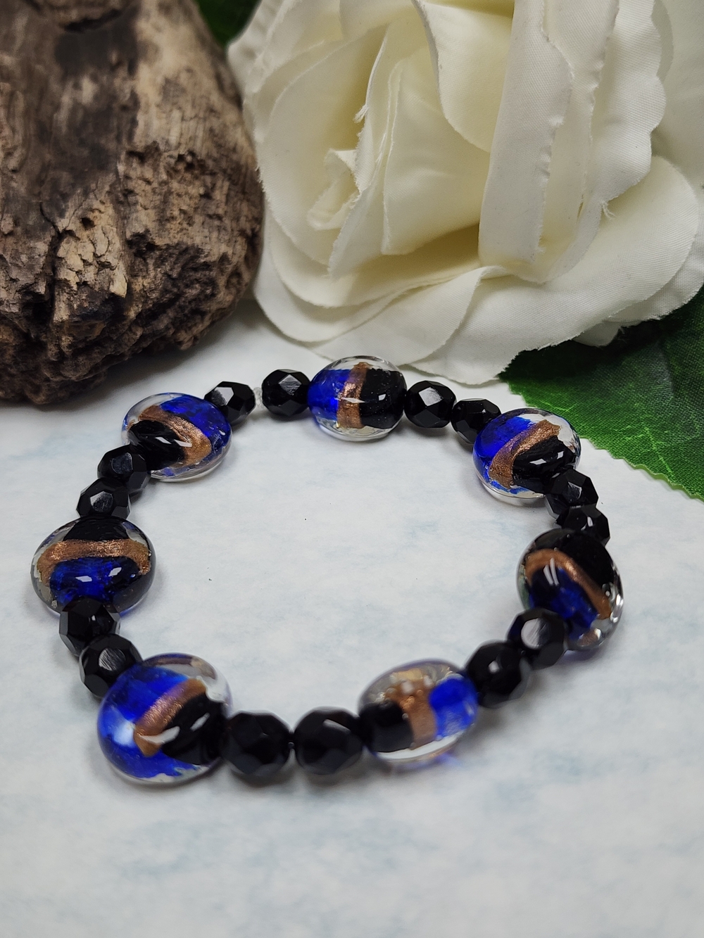Stretch Bracelet With Blue, Black & Gold Toned Glass Lampwork Beads
